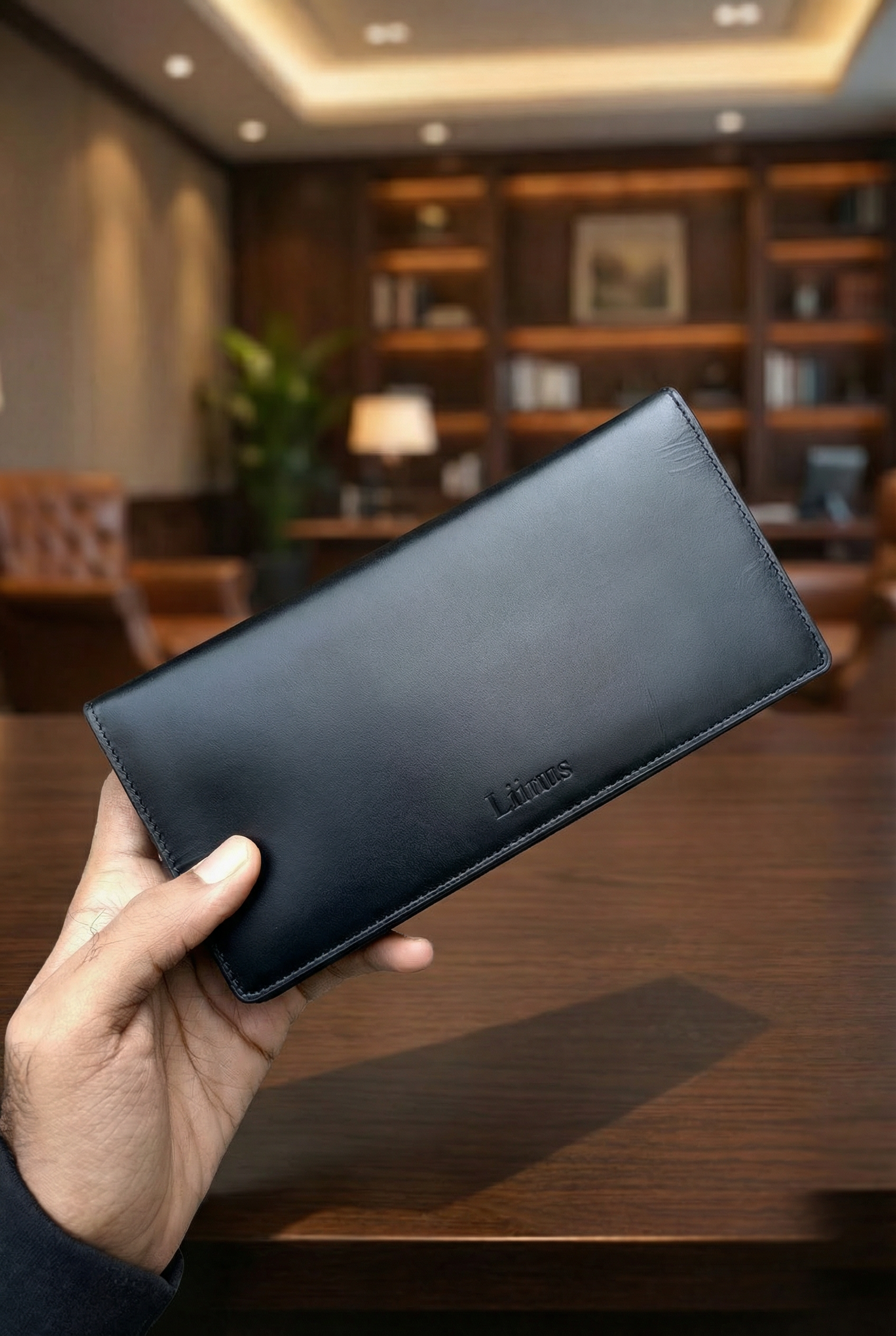 Angled view of men’s long leather RFID & NFC wallet in black